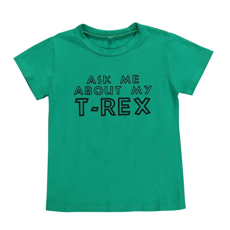 Green kids t-shirt with black text saying Ask me about my T-Rex dinosaur graphic tee