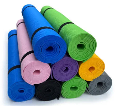 Stack of colorful rolled yoga mats, including blue, pink, green, yellow, black, and gray mats.