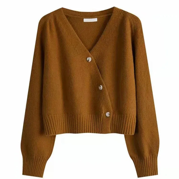 Brown cropped V-neck cardigan with long sleeves and ribbed cuffs and hem, featuring three buttons