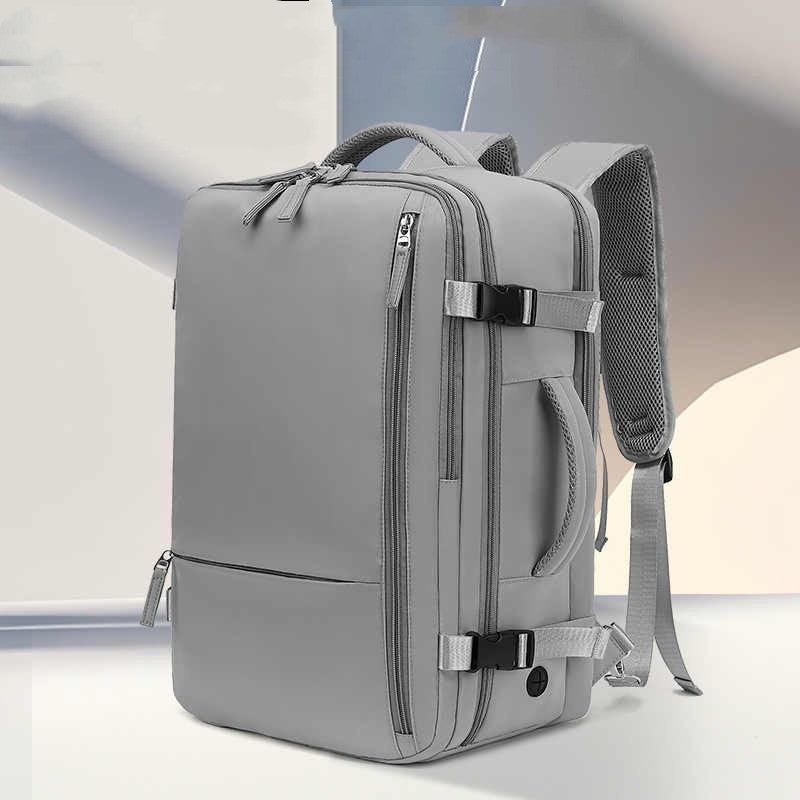 gray modern travel backpack with multiple zippered compartments and padded shoulder straps