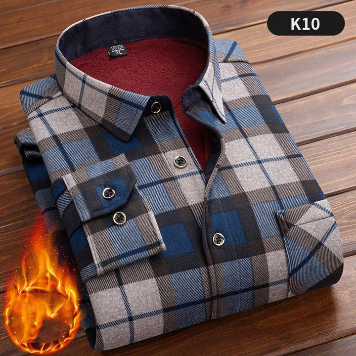 Folded blue and gray plaid flannel shirt with red fleece lining on wooden surface, labeled K10
