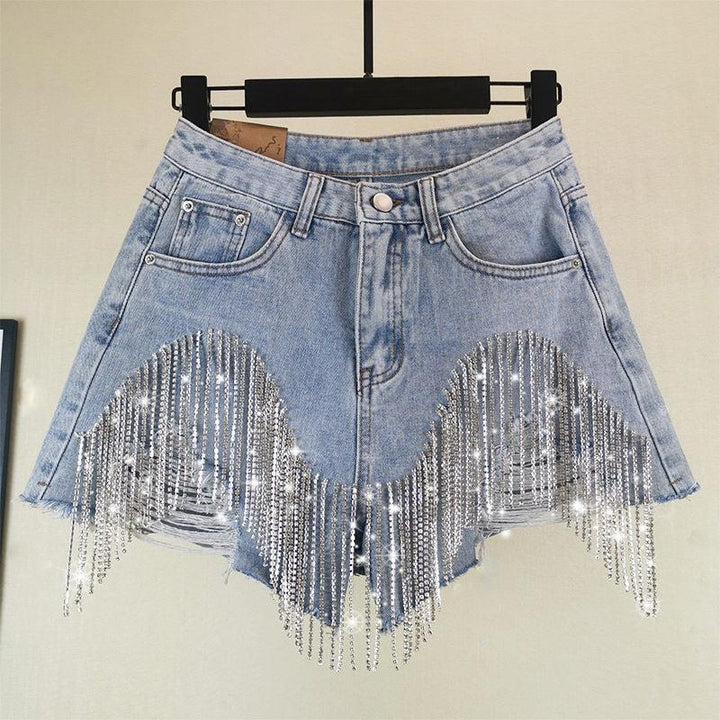 Light blue denim shorts with frayed hem and sparkling silver rhinestone fringe detail