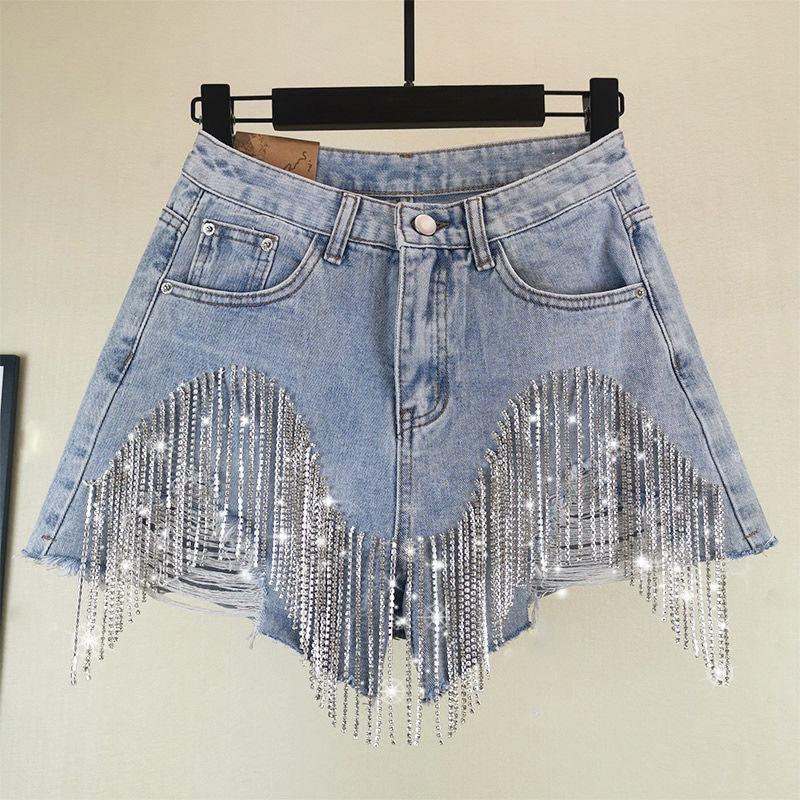Light blue denim shorts with frayed hem and sparkling rhinestone fringe detailing
