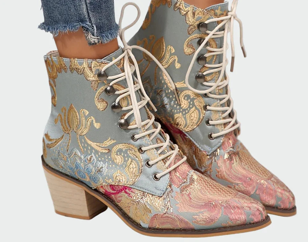 Women wearing ornate lace-up ankle boots with floral jacquard pattern and block heels
