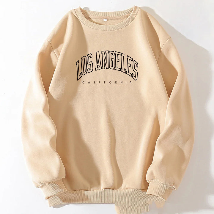 Beige sweatshirt with black Los Angeles California text printed on front, casual unisex pullover