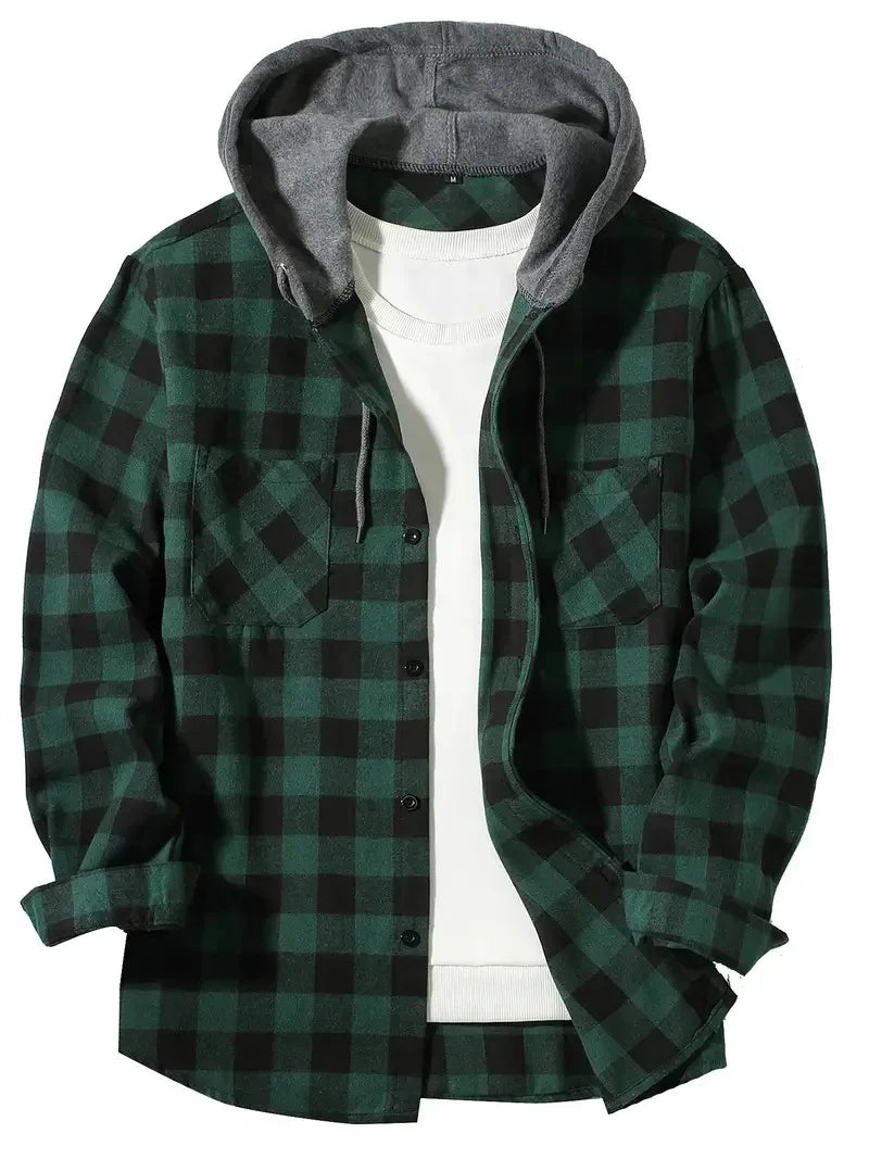 Green and black checkered flannel shirt with gray hood layered over white crew neck shirt