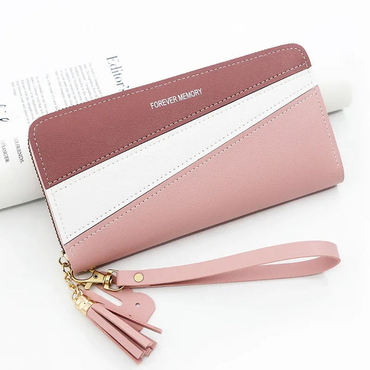 Tri-color wristlet wallet in pink, white, and mauve with tassel and "FOREVER MEMORY" text