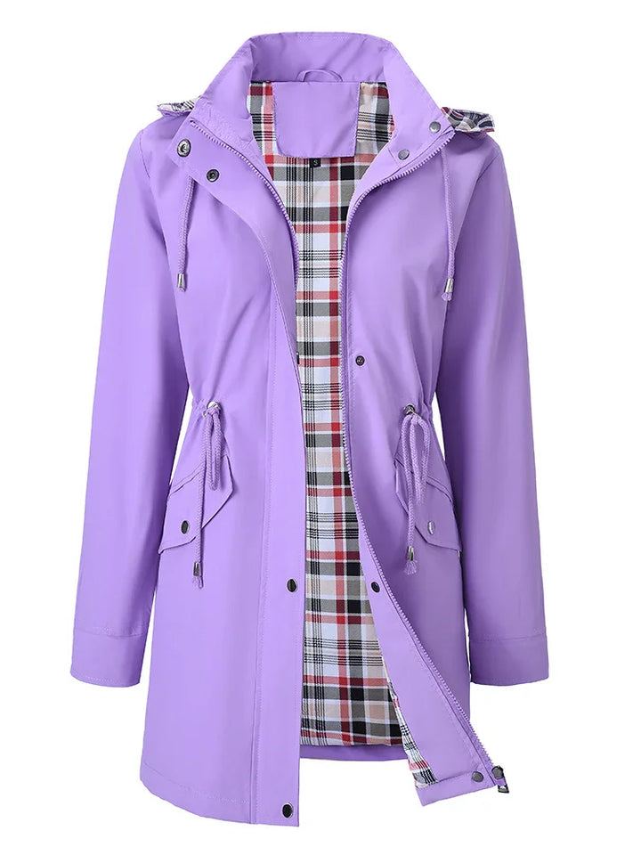 Lilac women's raincoat with hood, drawstring waist, snap buttons, and plaid inner lining