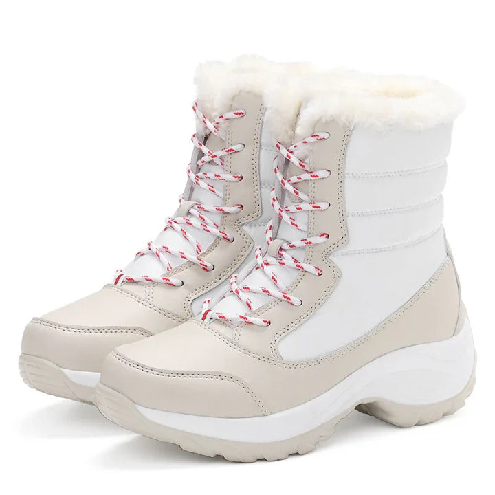 Beige and white winter boots with red and white laces and plush fur lining