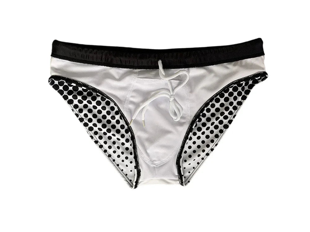 White men's swim briefs with black waistband and black polka dots on sides, front tie detail