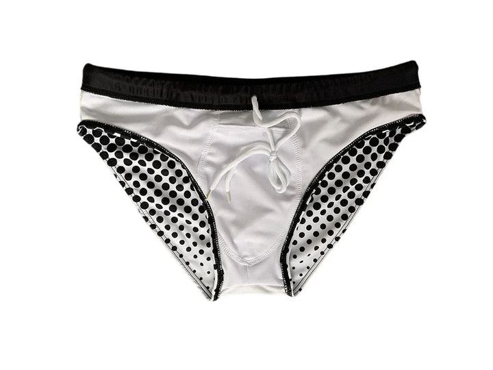 White men's swim briefs with black waistband and black polka dots on sides, front tie detail
