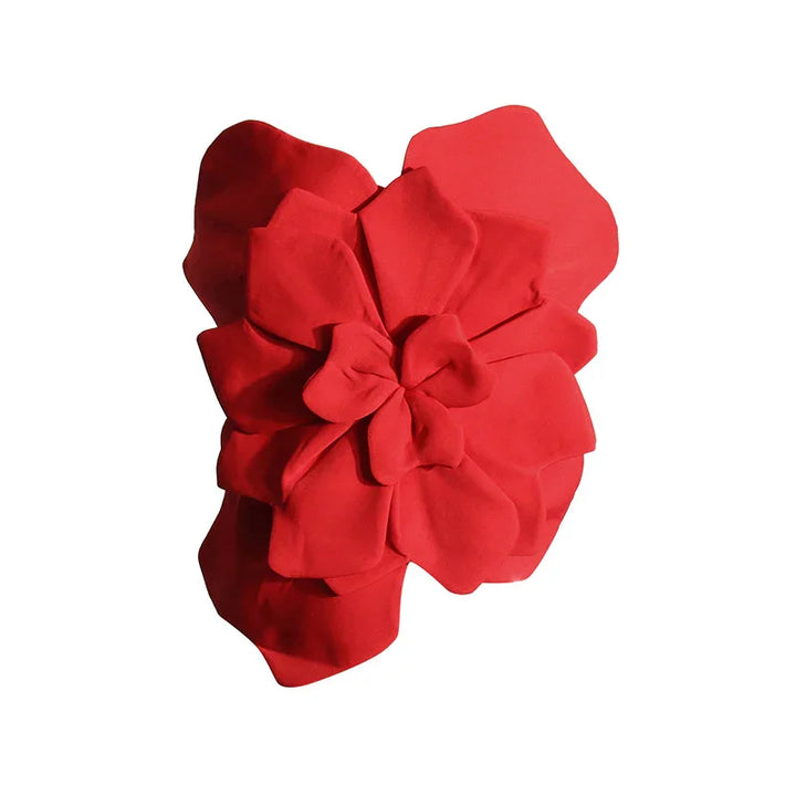 Large red fabric flower with multiple layered petals on white background