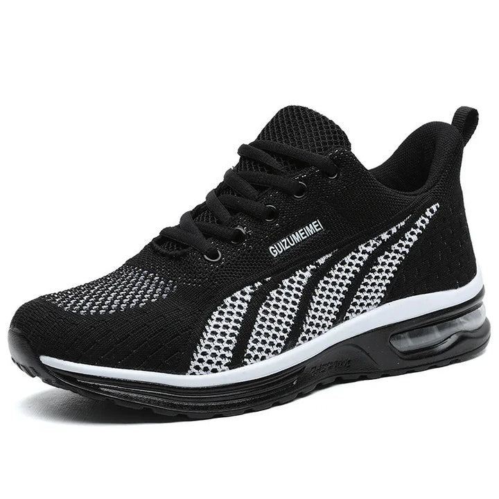 Black and white breathable mesh athletic sneaker with air cushion sole and laces