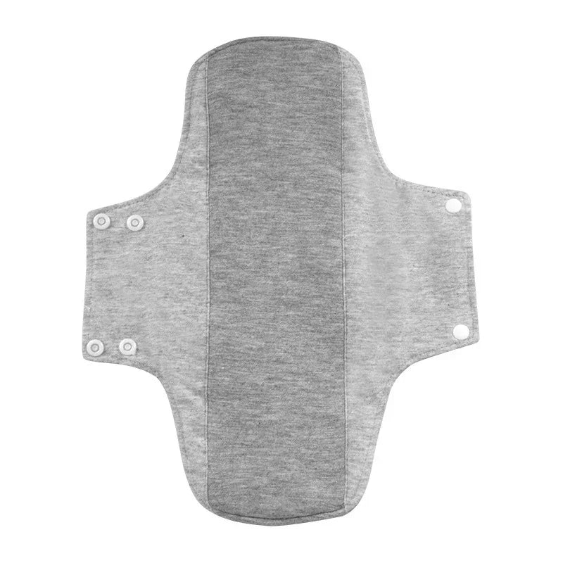 light gray reusable fabric pad with snap buttons on sides for adjustable fit