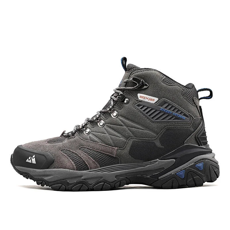 Gray and black mid-top hiking boot with rugged sole and metal eyelets for outdoor use