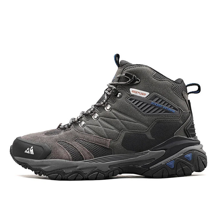 Gray and black mid-top hiking boot with rugged sole and metal eyelets for outdoor use