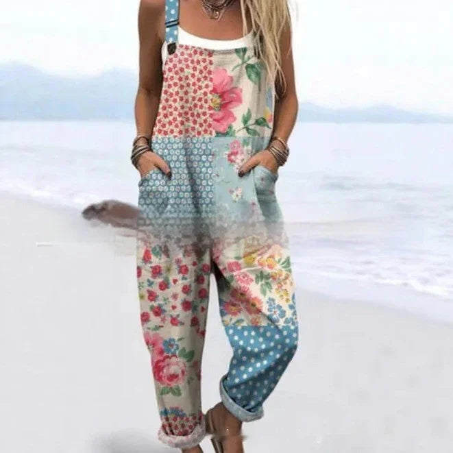 Woman wearing patchwork floral and polka dot overalls on a beach background