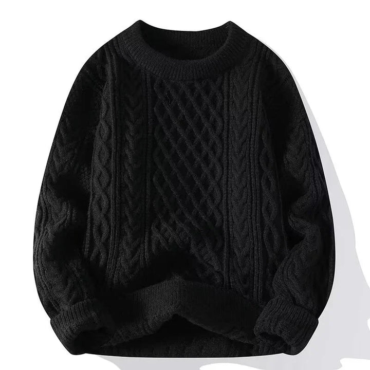 Black cable knit sweater with textured braided pattern and rolled cuffs
