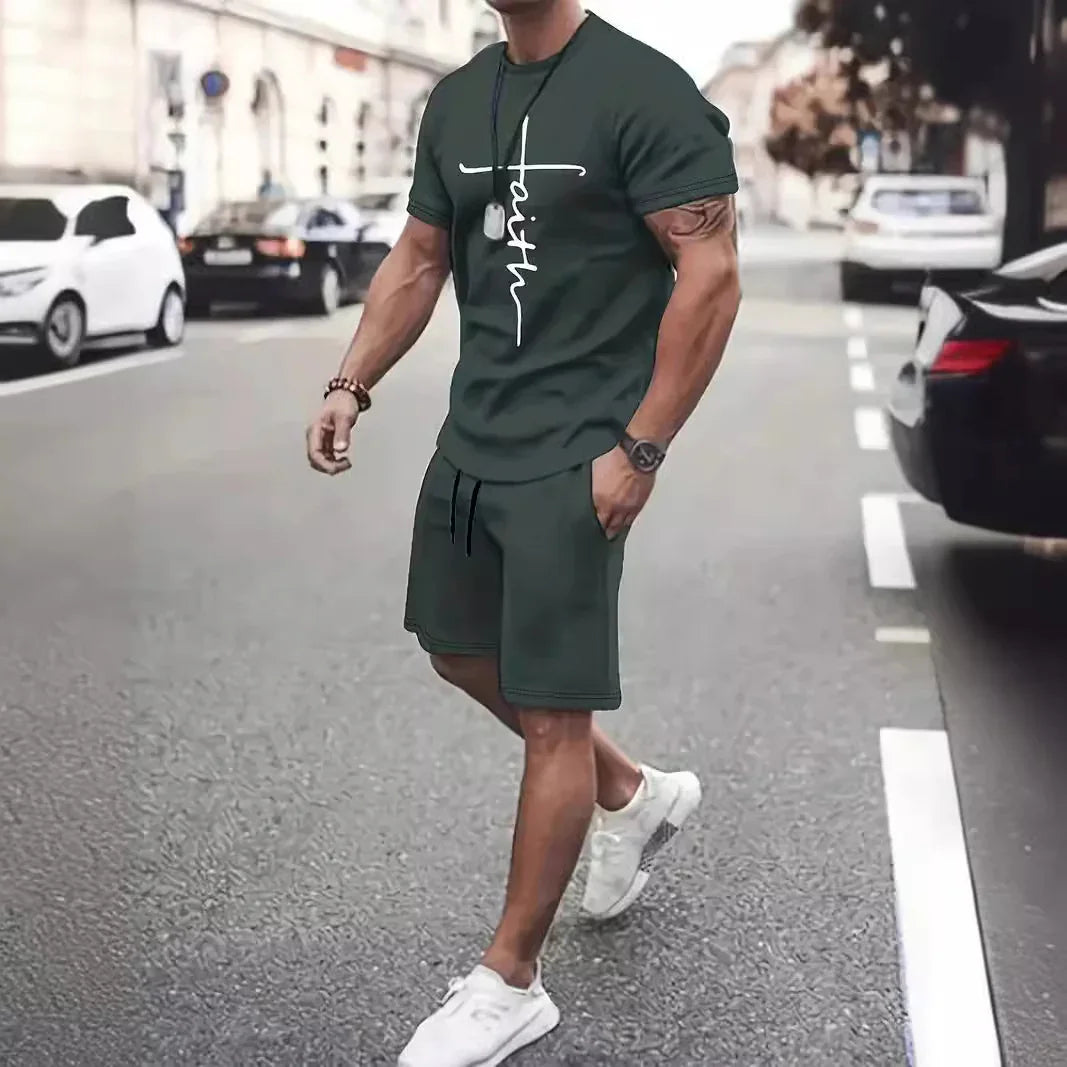 Man walking on street wearing dark green faith graphic t-shirt and shorts with white sneakers