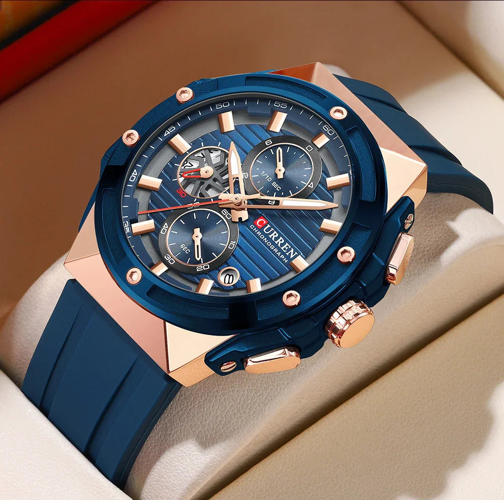 Close-up of blue and rose gold Curren chronograph wristwatch with blue silicone strap