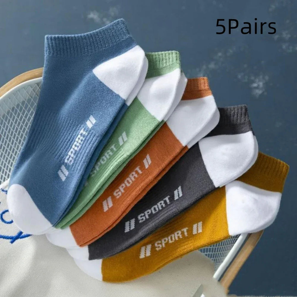 Set of five pairs of ankle sport socks in blue, green, orange, gray, and yellow with white accents