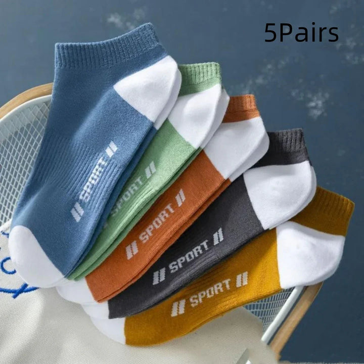 Set of five pairs of ankle sport socks in blue, green, orange, gray, and yellow with white accents