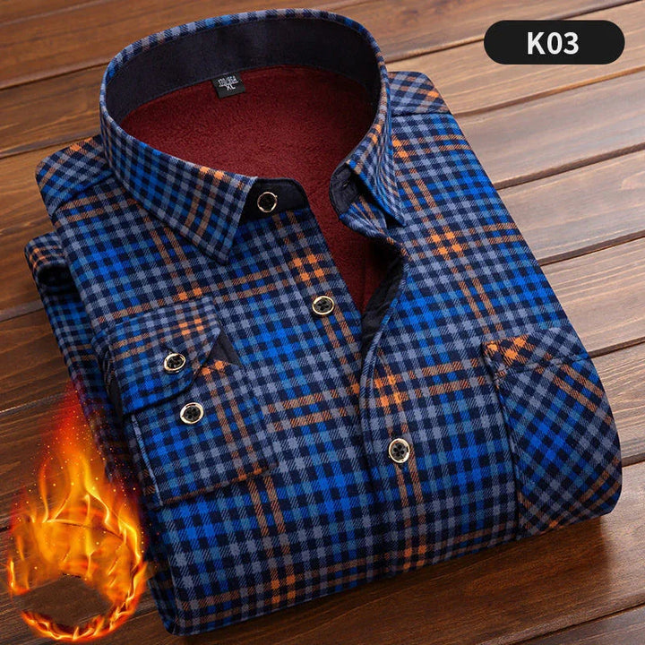Folded blue and orange plaid flannel shirt with warm lining on wooden surface, labeled K03